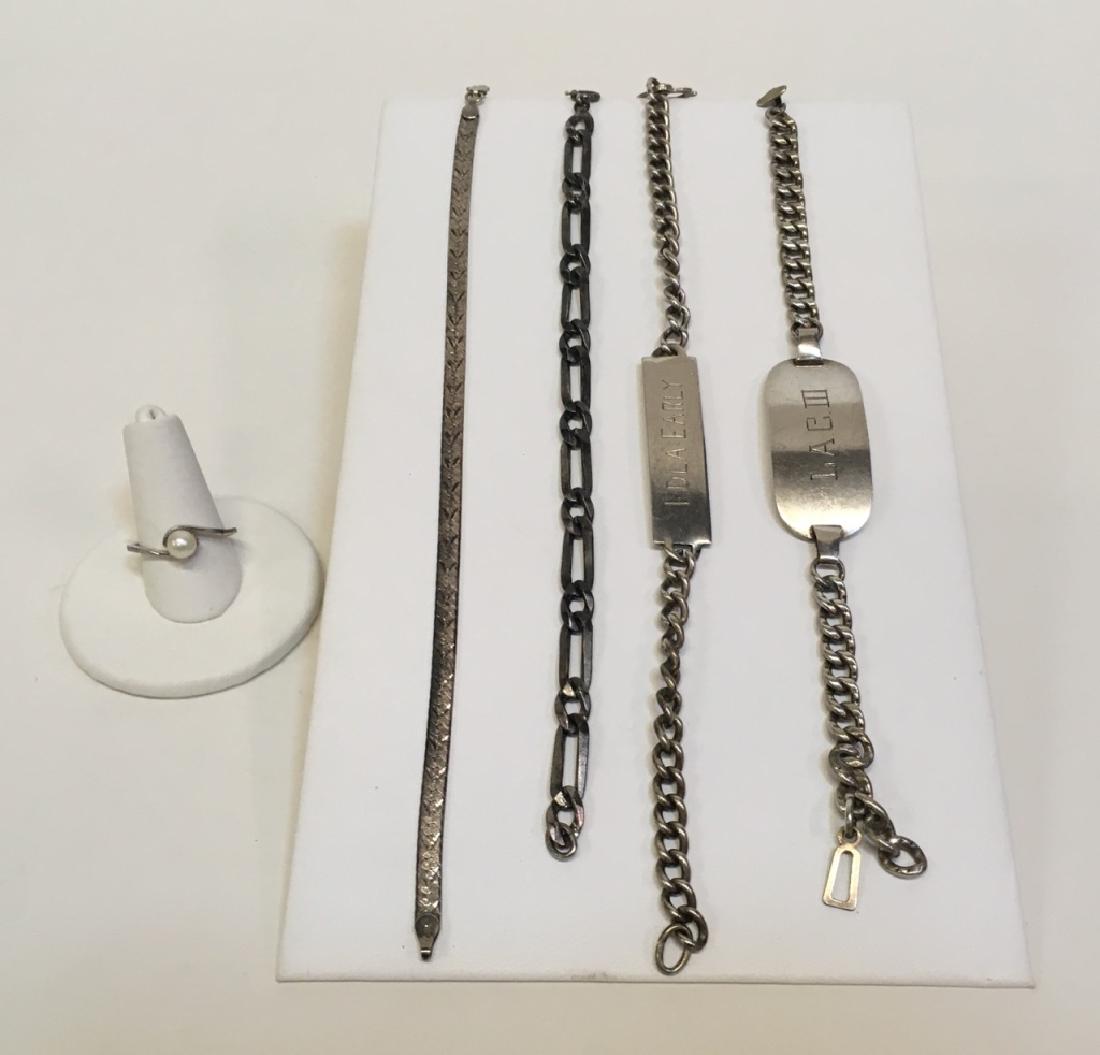 5 PCS STERLING / 925 JEWELRY - 1 RING, 4 BRACELETS: Sterling cultured ring sz 7, 8" 925 Italy herringbone bracelet, 7" sterling link bracelet, 8" sterling bracelet engraved Edla Early & 7" sterling bracelet engraved LAC III. Total weight - 49g.