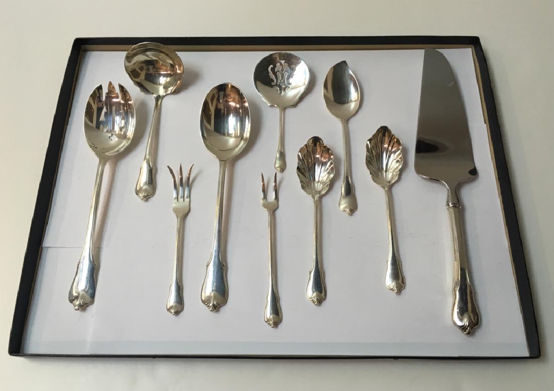 10 PCS OF STERLING GRAND COLONIAL BY WALLACE: Sterling flatware in the "Grand Colonial" pattern by Wallace - 1 gravy ladle, 2 sugar shells, 1 jelly server, 1 serving spoon, 1 pierced serving spoon, 1 bon bon spoon, 1 lemon fork, 1 pickle fork, 1 