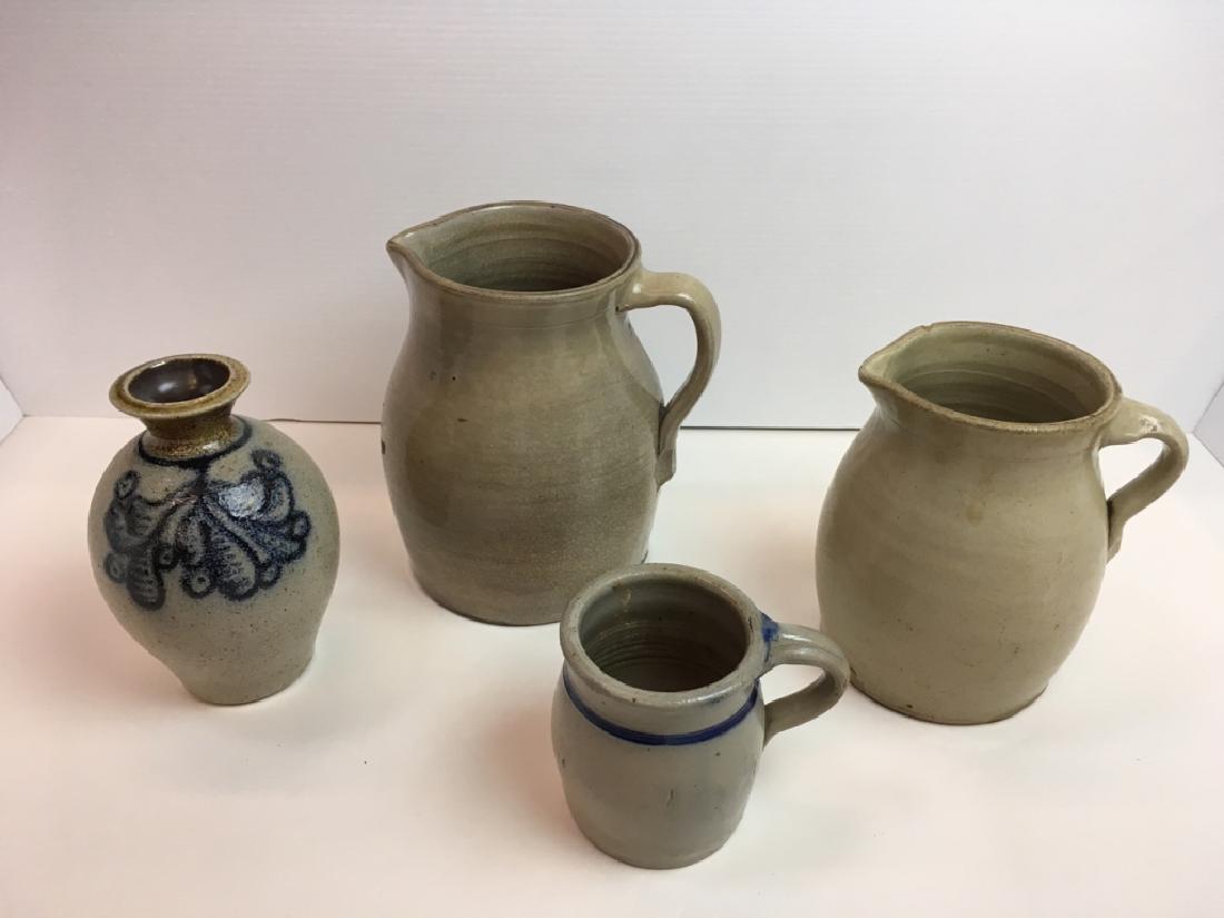 4 STONEWARE PCS - PITCHERS, VASE & MUG: Antique pitcher 9" h x 7" diameter (crazed), antique pitcher 7.5" h x 6" diameter (rim chip), salt glazed cobalt peacock decorated vase signed Jeff Procter (Salem, Oregon) 7.5" h x 5" diameter & salt 