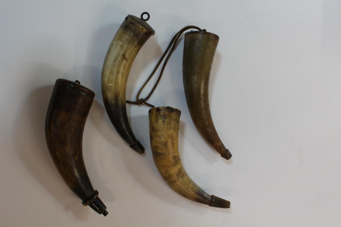 FOUR VINTAGE HUNTING BLACK POWDER HORN FLASK: Each piece approx. 9" long and 2.5" wide - Typical wear and age showing.