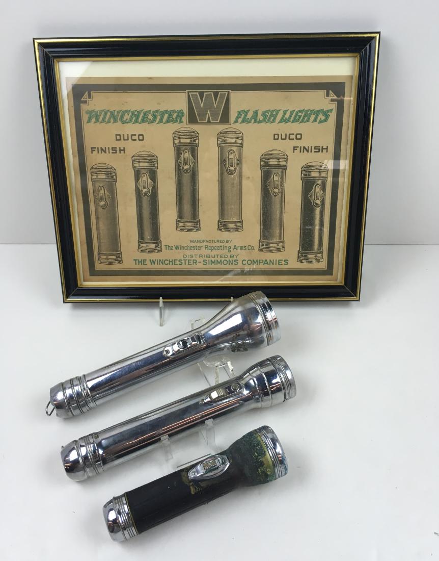 4 PCS- 3 WINCHESTER FLASHLIGHTS & ADVERTISING CARD: Winchester silver tone 10" flashlight in working condition, Winchester silver tone 9.75" in working condition (screw cap is split & "Wizard" interior cap is damaged (see photos) & Winchester black 7" 