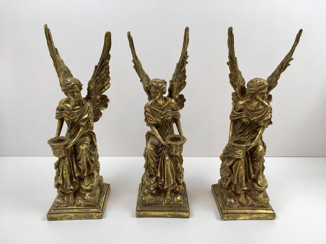 3 MARK ROBERTS DECORATIVE ANGEL CANDLE HOLDERS: Composite Mark Roberts gold angels candle holders - 14" tall with a 4" square base