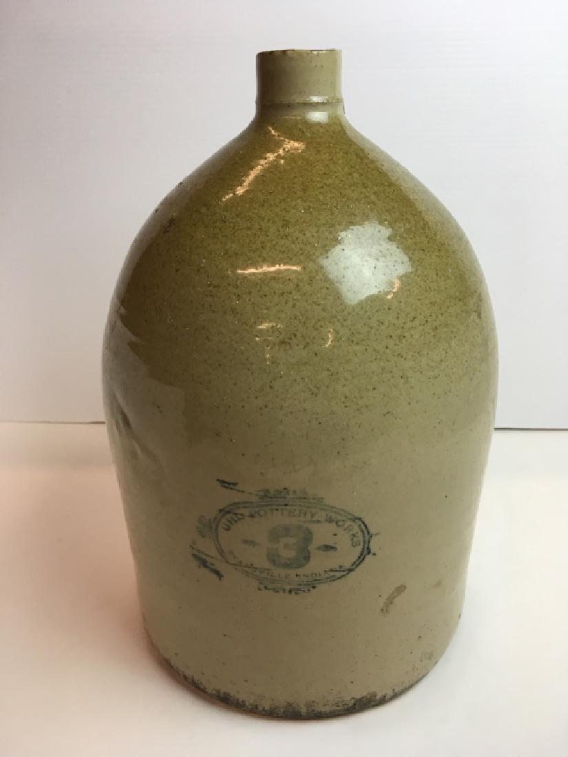 19TH C COBALT DECORATED STONEWARE JUG: 3 gallon jug decorated on the front in cobalt "UHL Pottery Works 3 Evansville Indiana"- 15" h x 9.75" diameter. Good condition having hairline rim crack, 1 base chip & white paint over spray specks (c
