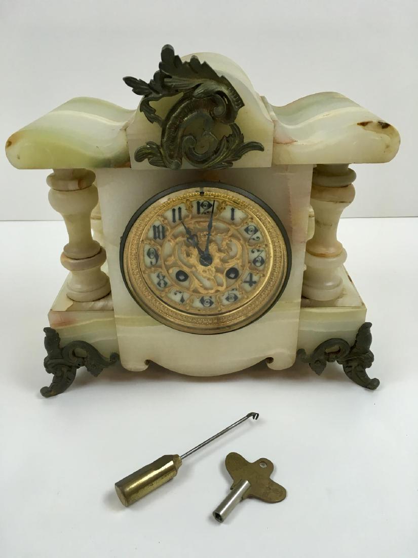 ANTIQUE FRENCH MANTEL CLOCK: Onyx and ormolu French mantle clock - enamel dial with gilt metal face - chime works - needs to be level to run - marked France - includes key and pendulum 10.75" l x 5" w x 10" h