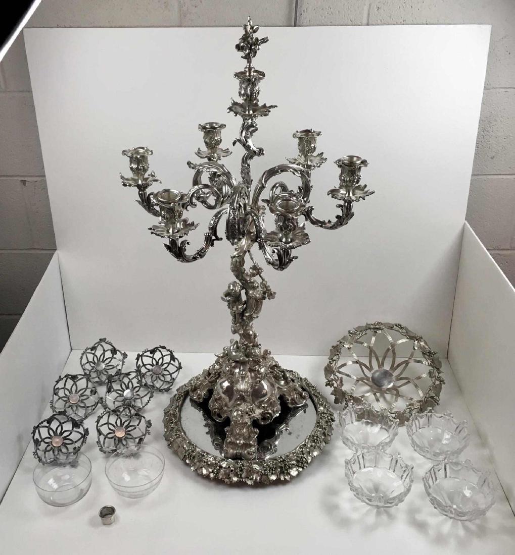 ANTIQUE SILVER-PLATE CANDELABRUM AND PLATEAU: Large 33 inches tall Louis XVI style seven light candelabrum hallmarked Elkington & Co. of Birmingham - the triform base rises to grape vine and leaf covered stem ending in scroll form arms - 2 putti 