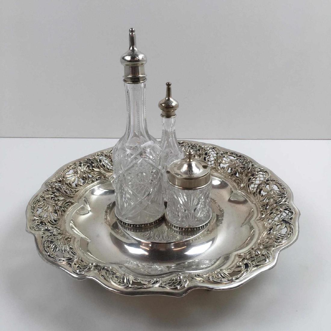 STERLING SILVER RETICULATED TRAY CRUET SET: Mauser Mfr. Co. New York - round sterling footed tray with fitted area for cut glass cruet bottles and condiment jar - triple monogram - tray measures 2.5 inches h x 12.75 inches diameter - weighs 576