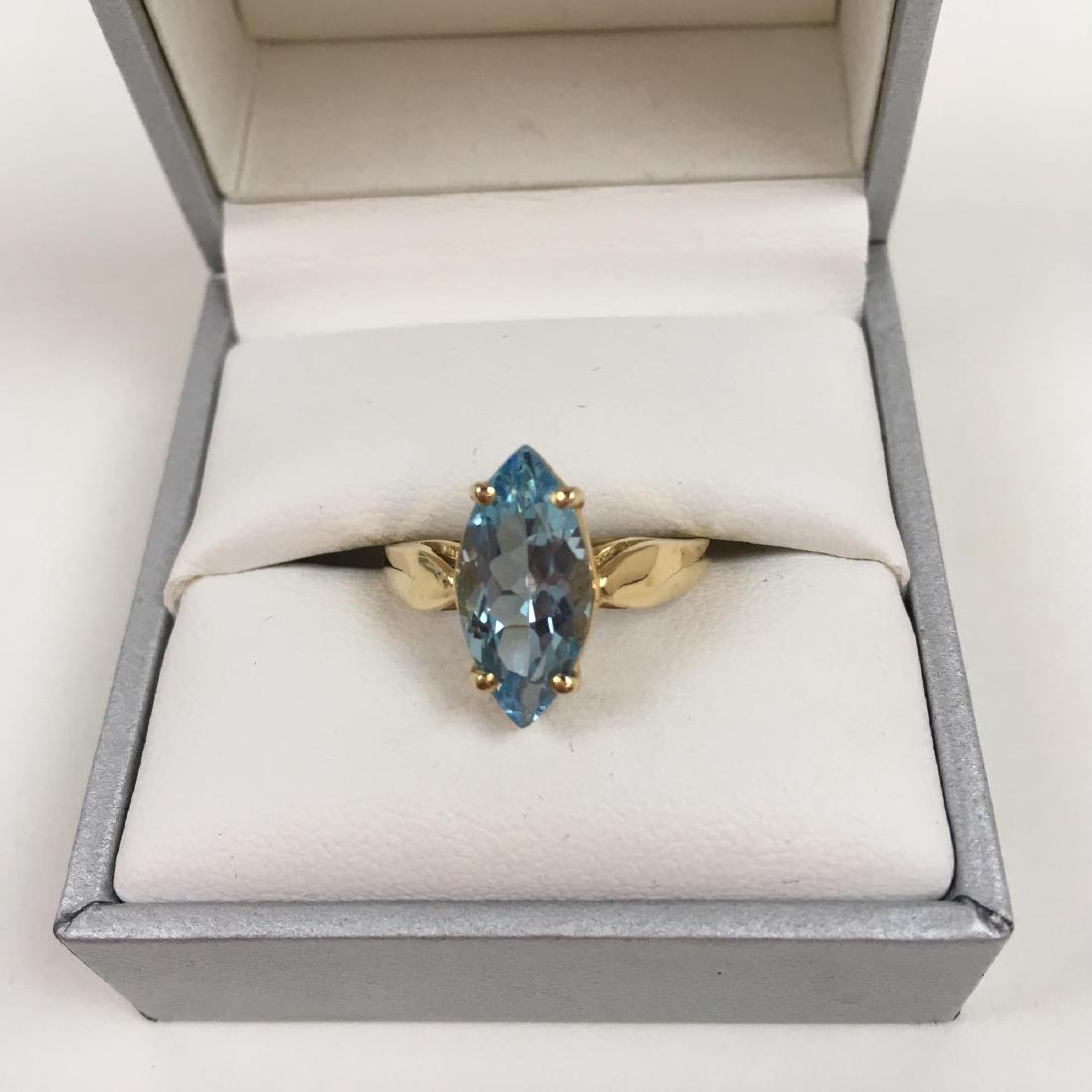 14K YELLOW GOLD AND TOPAZ RING: 14 karat yellow gold and topaz ring size 7.5 3 g