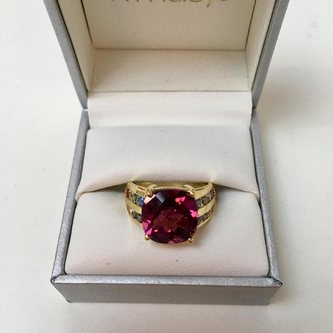 18K YELLOW GOLD PINK TOURMALINE RING: 18 karat yellow gold ring with large pink tourmaline center stone with ruby and sapphires side stones - size 8 9 g