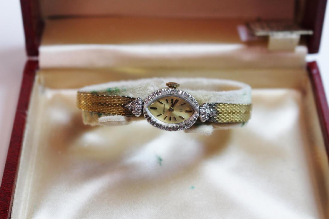14K GOLD CASE LADIES HAMILTON WATCH: Band is not 14K only the watches case - Diamonds surround the face - 6 - 6.5"