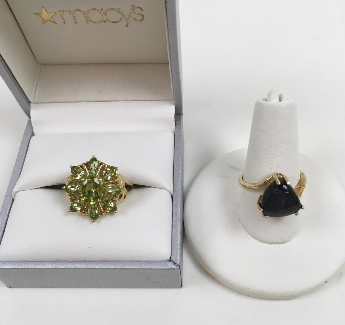 TWO 10K YELLOW GOLD RINGS: Two 10 karat yellow gold rings - peridot size 6 3 g and a labradorite size 6 3 g