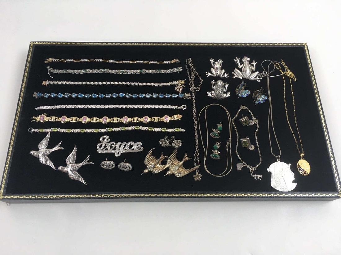 ASSORTED 925 / STERLING AND 800 JEWELRY: Includes necklaces, bracelets, pins, earrings - pierces, clip and screw back earrings - butterfly clip earrings are marked 800 - bird pins are by Coro - weight is approximately 141 g