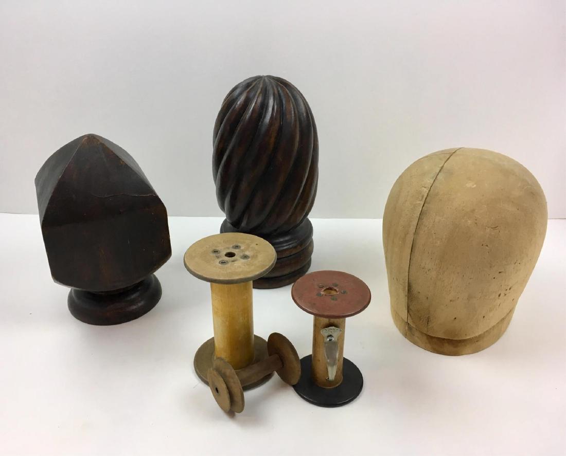 ANTIQUE NEWEL POST TOPS, SPOOLS AND HAT FORM: 2 carved wood newel post tops - 5.25" sq x 9" and 5.25" diameter x 10.5", carved wood hat form 6" diameter x 8.5" plus 3 spools - 5.5" Belding Hemingway Corticelli, 4.5" Cedar Throwing Mills and unmar