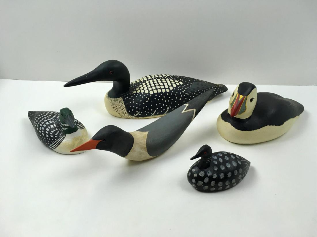 FIVE CARVED WOOD PAINTED DECOYS: 16" Common Loon from the Decoy Shop Freeport Maine signed Elizabeth Meigs Morrison 1985, 13" with red beak signed MR or MB, 10.5" puffin from the Decoy Shop Freeport Maine, 8.5" signed Roy White Knott