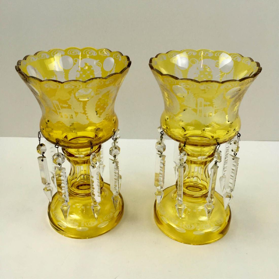 PAIR OF VINTAGE CUT TO CLEAR MANTLE LUSTERS: Beautiful pair of Bohemian yellow / amber cut to clear mantle lusters - etched designs showing cottage, stags and birds - each luster has 8 prisms - one prism has small chip on tip base otherwise in v