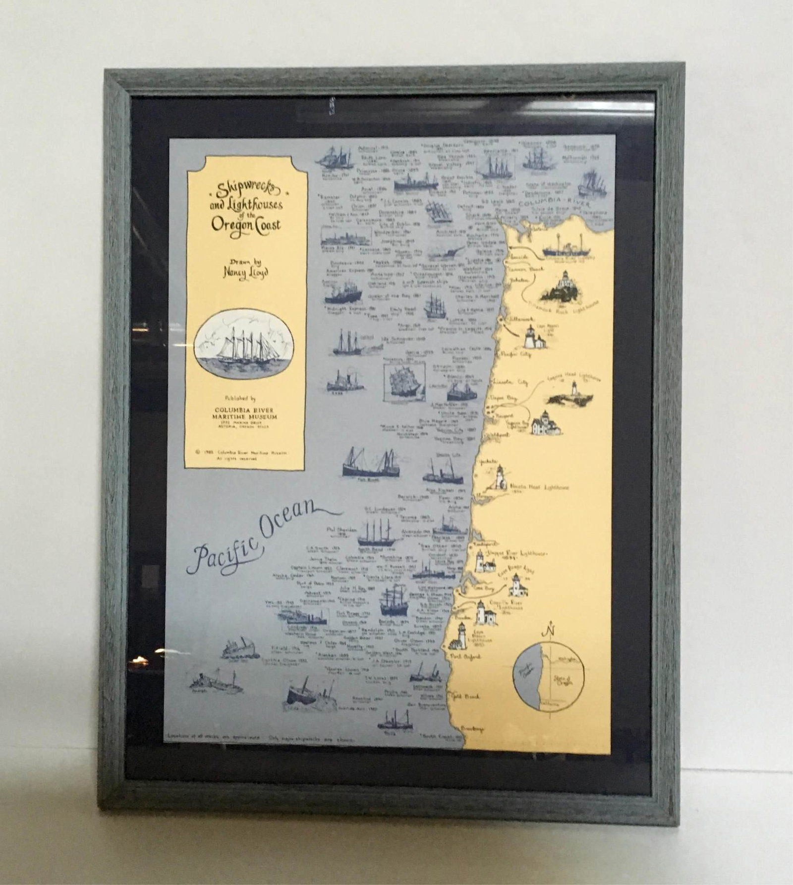 PRINT OF SHIPWRECKS & LIGHTHOUSES - OREGON COAST: Framed print of major shipwrecks and lighthouse of the Oregon Coast drawn by Nancy Lloyd and published by Columbia River Maritime Museum 1985 - 16" x 22.25" frame 21" x 27"