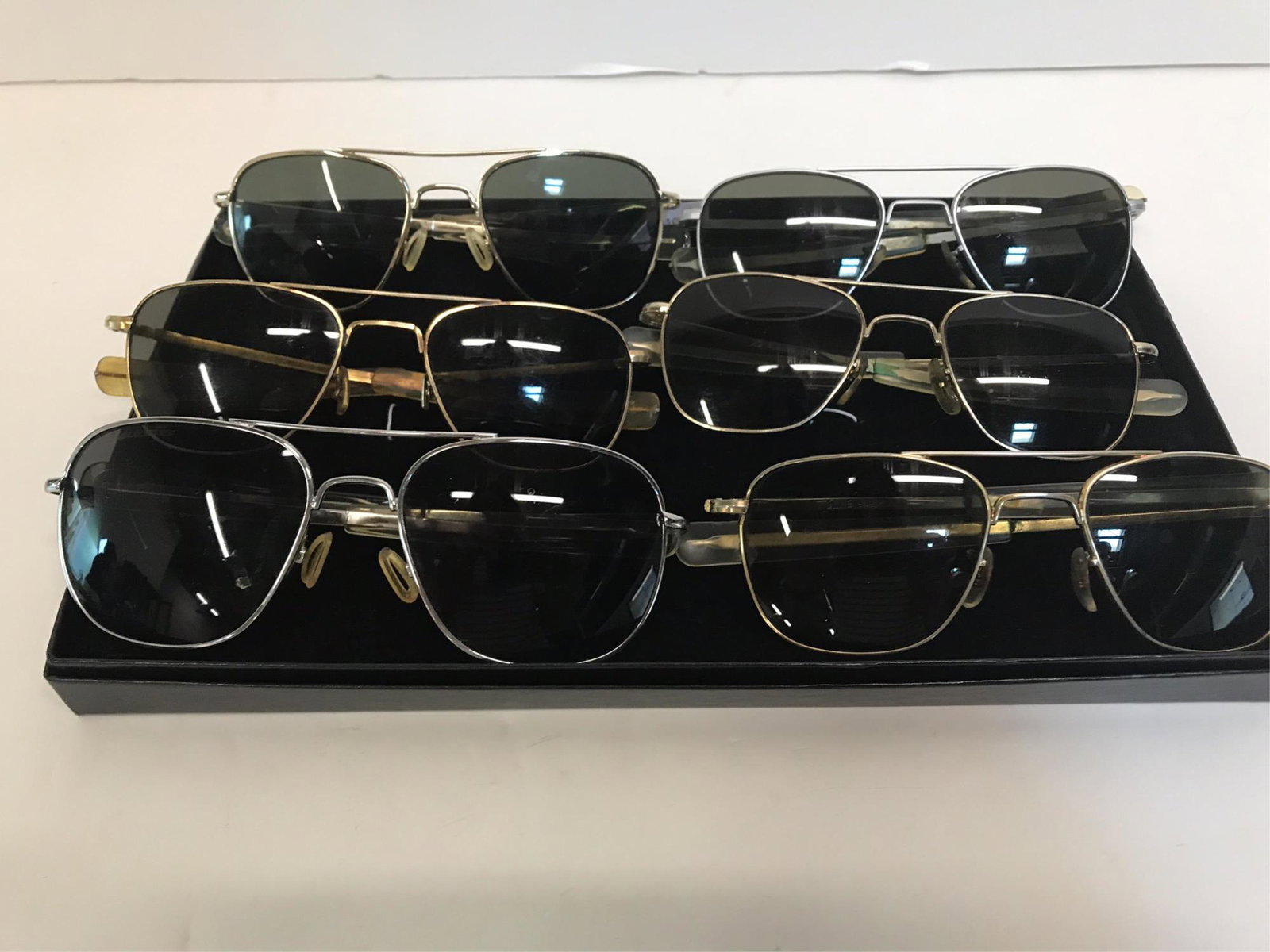 6 PAIR VINTAGE AVIATOR SUNGLASSES: 3 pair American Optical AO US Pilot 52/20 gold aviator sunglasses with gray lens with one pair 12k gold filled and has significant cracking of side plastic covering; pair of American Optical AO US Pil