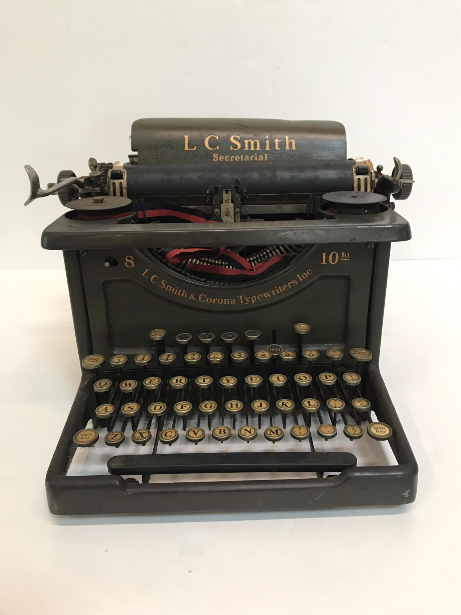 L.C. SMITH SECRETARIAL TYPEWRITER: serial number 2-8-s , 1000 key broken, @ key sticks, 14" x 14.75" X 10.25" , 10" platen