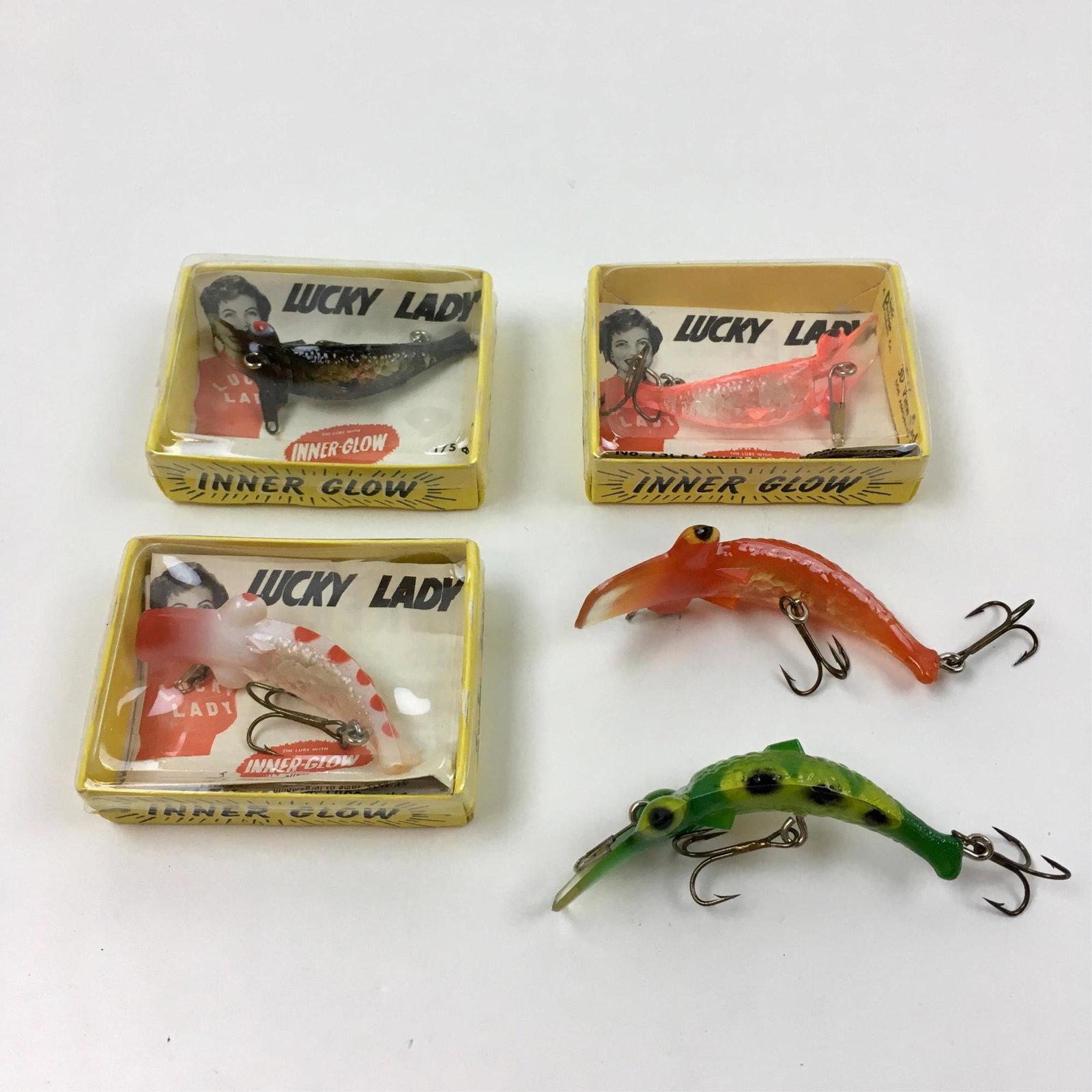 5 VINTAGE LUCKY LURE FISHING LURES: 5 vintage Lucky Lure fishing lures with inner glow - 3 are NIB #15CF, 15BF and 1/5 plus 2 loose ones - by Lucky Lady Tackle Co. Los Angeles CA