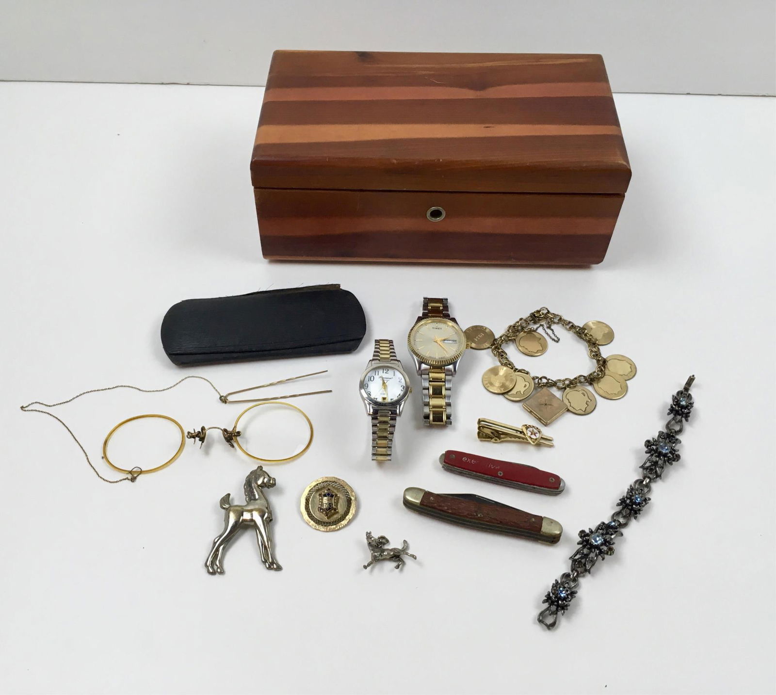 ASSORTED ITEMS - WATCHES, JEWELRY & MORE: Vintage 1927 Pi Sigma Eta gold filled round pin, vintage gold filled charm bracelet, 2 pocket knives Texaco tie clasp, men's Timex Indiglo wrist watch, Precision by Gruen quartz watch, antique glasses
