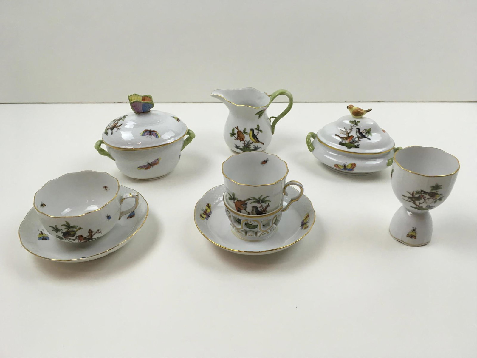 ASSORTED HEREND ROTHSCHILD BIRD CHINA: Two lidded sugar bowls, cream pitcher, egg cup, Trembleuse cup & saucer, cup & saucer in used condition with saucer chip - all other pieces with no chips or cracks