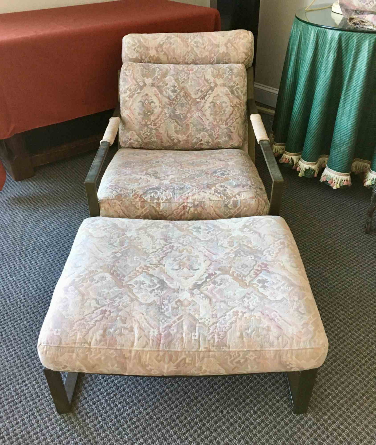 VTG MILO BAUGHMAN MID-CENTURY CHAIR AND OTTOMAN: Designed by Milo Baughman in 1965 - brushed bronze finish - both chair and ottoman have been re-upholstered in a tapestry fabric which shows some fading