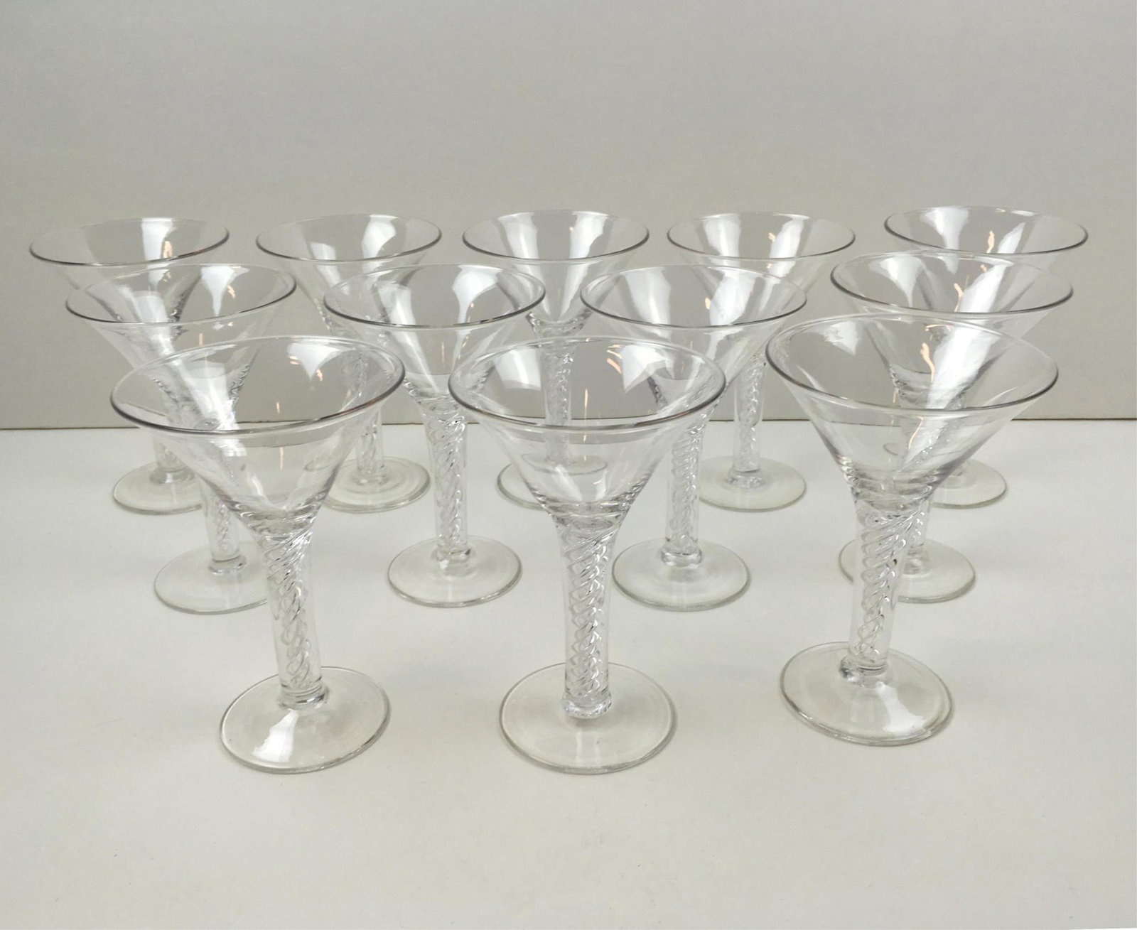 12 AIRTWIST WINE GLASSES: 12 Airtwist wine glasses made by Royal Leerdam of Holland or Blenko for Colonial Williamsburg - hand blown lead crystal spiral air-twist forms - approximately 6.5" tall with 4.5" top diameter - no dam