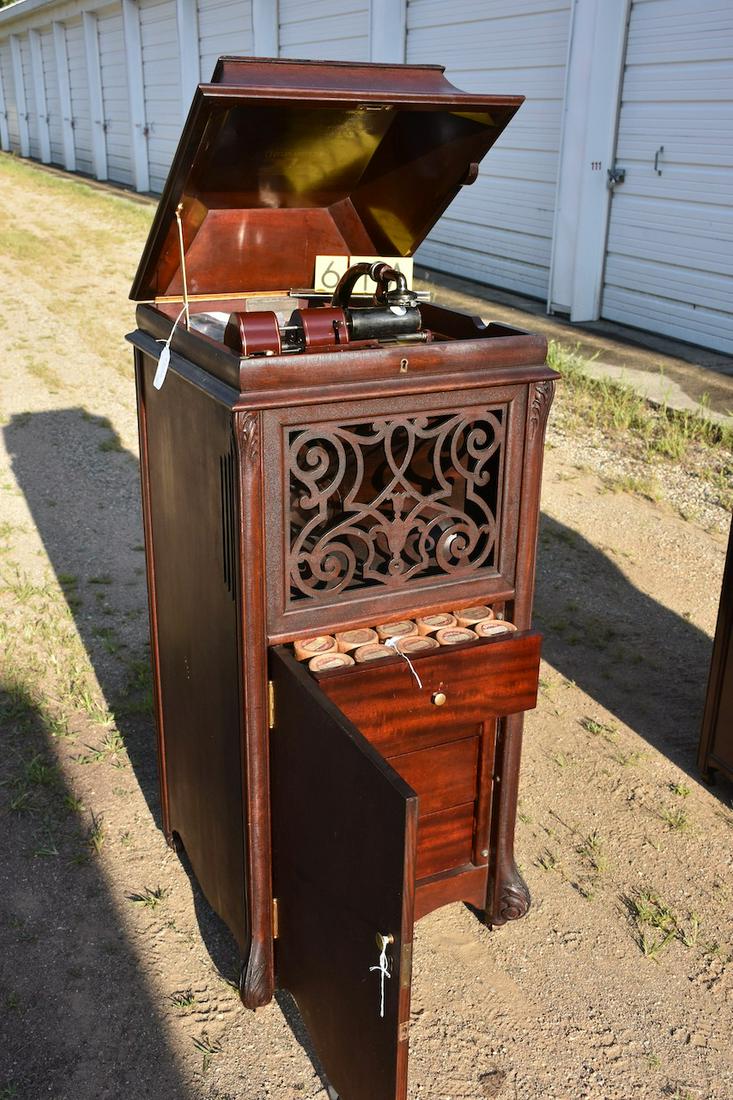 Edison Amberola Model A Cylinder Phonograph: Type SM. Mahogany case with slide-in reproducer, crank, and drawered cylinder record storage in the base of the cabinet