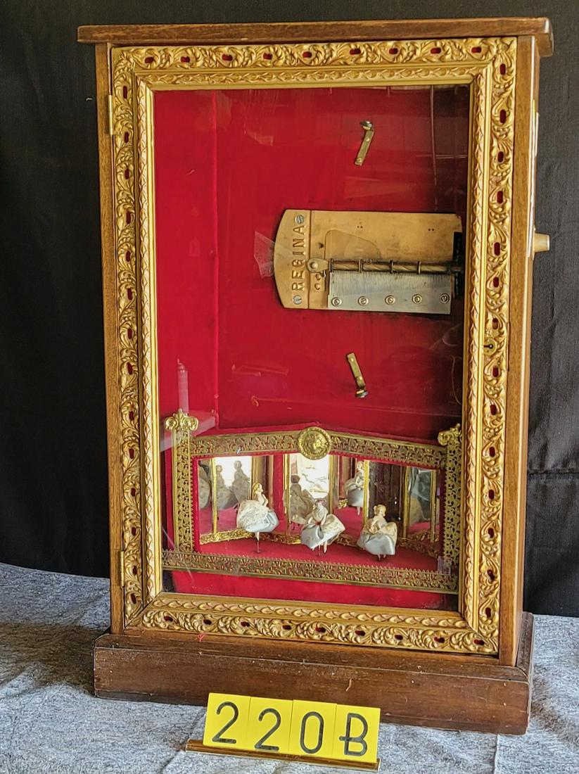 Regina Coin-Operated disc music box with dancing dolls: 3 Dancing dolls. Plays well. 6 discs included. Ca. 1950's