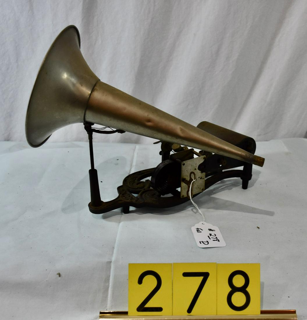 Puck cylinder phonograph, string driven example: Has winding key and horn. No reproducer