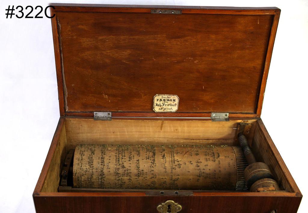 Early table model wood barrel organ: Made in Vienna, has interior makers tag