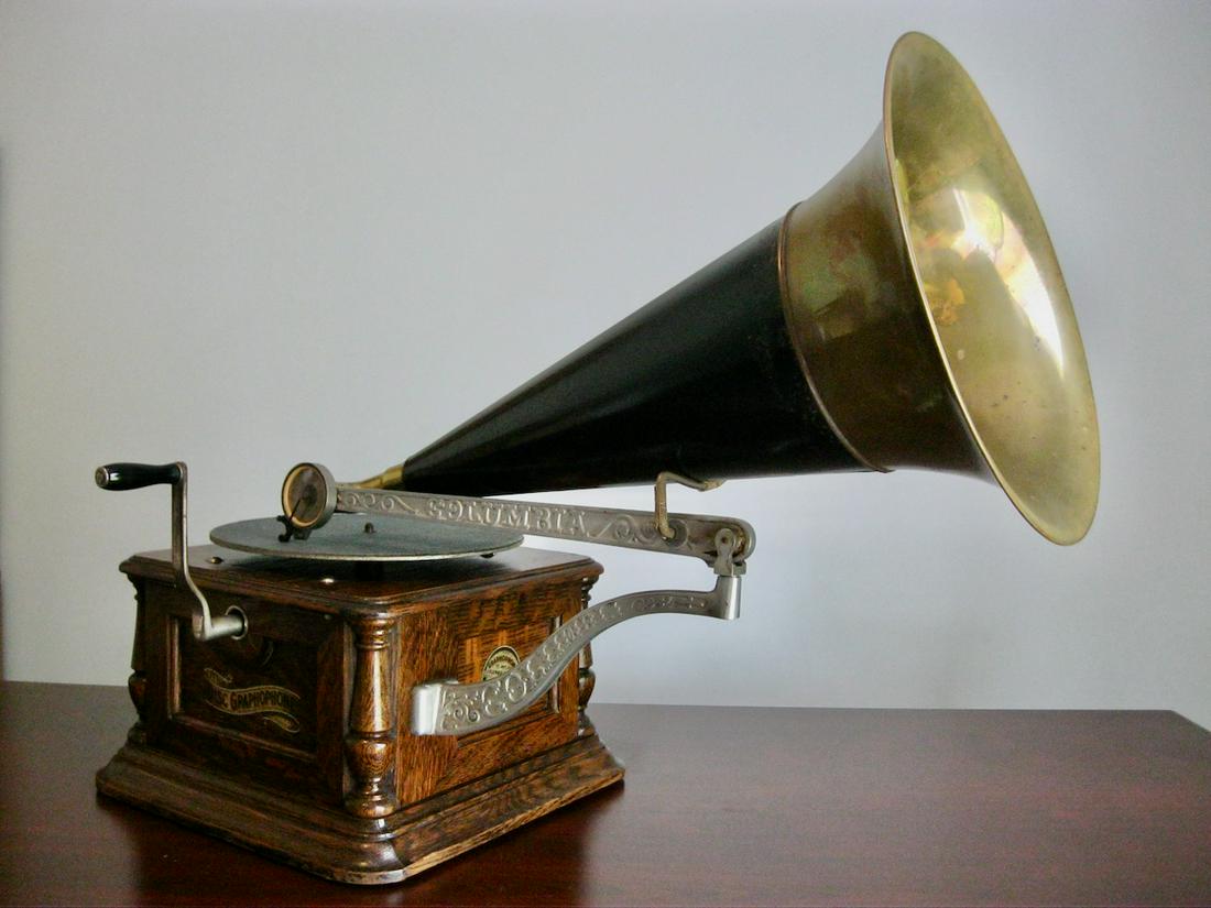 Columbia AH (2nd Style) disc Phonograph: Original turntable felt and crank. Disc phonograph with brass bell front mount horn. Reproduction arms.