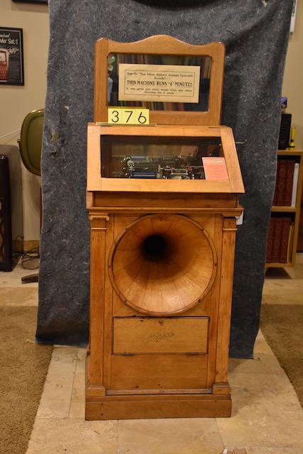 Regina Hexaphone Coin Operated Automatic Phonograph: Model 102. Plays 6 records, has crank, backsplash. SN-1021517. Very good