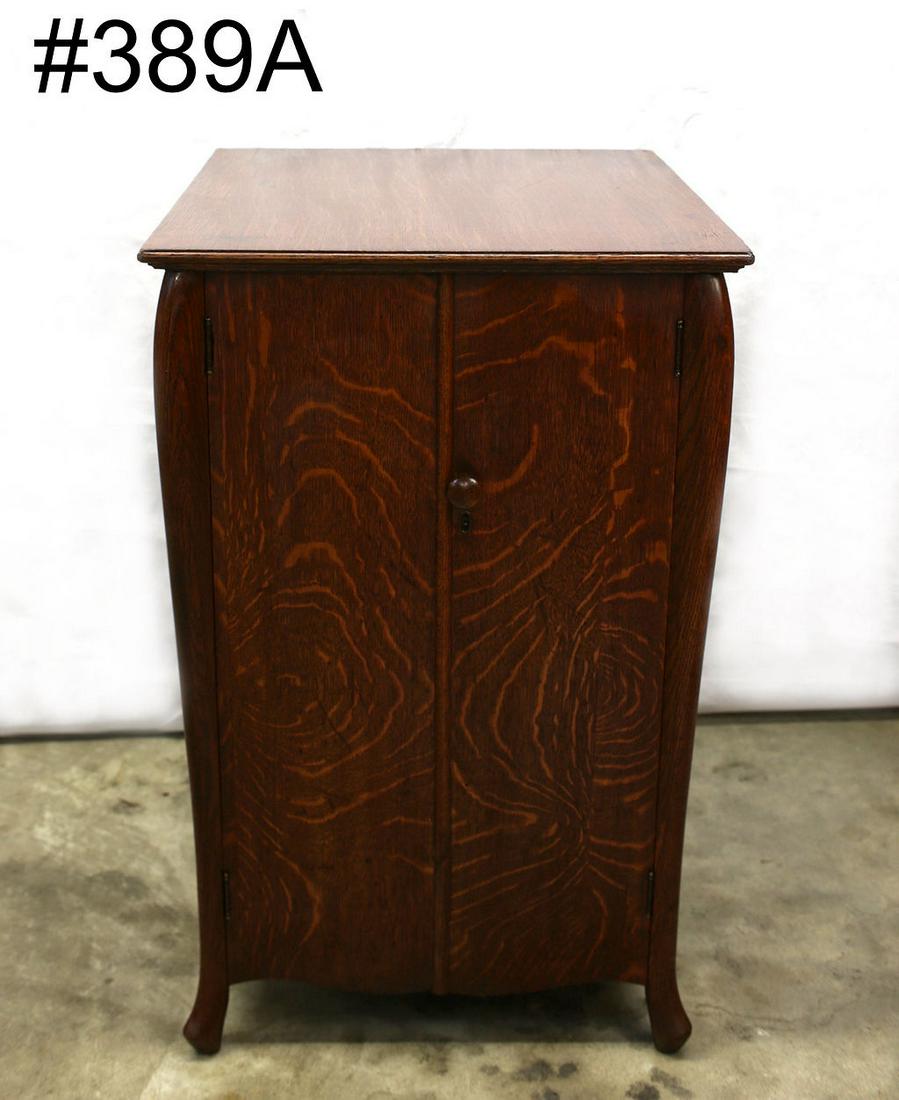 Oak two-door record cabinet with divided two tier: Oak two-door record cabinet with divided two tier interior