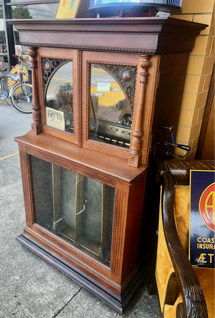 Regina Style 34 Automatic Changer Music Box: Mahogany split door example. Stores and manually or automatically selects one of the twelve discs stored in the unit. Very good condition. Similar example pictured on page 203 of Bower's Book