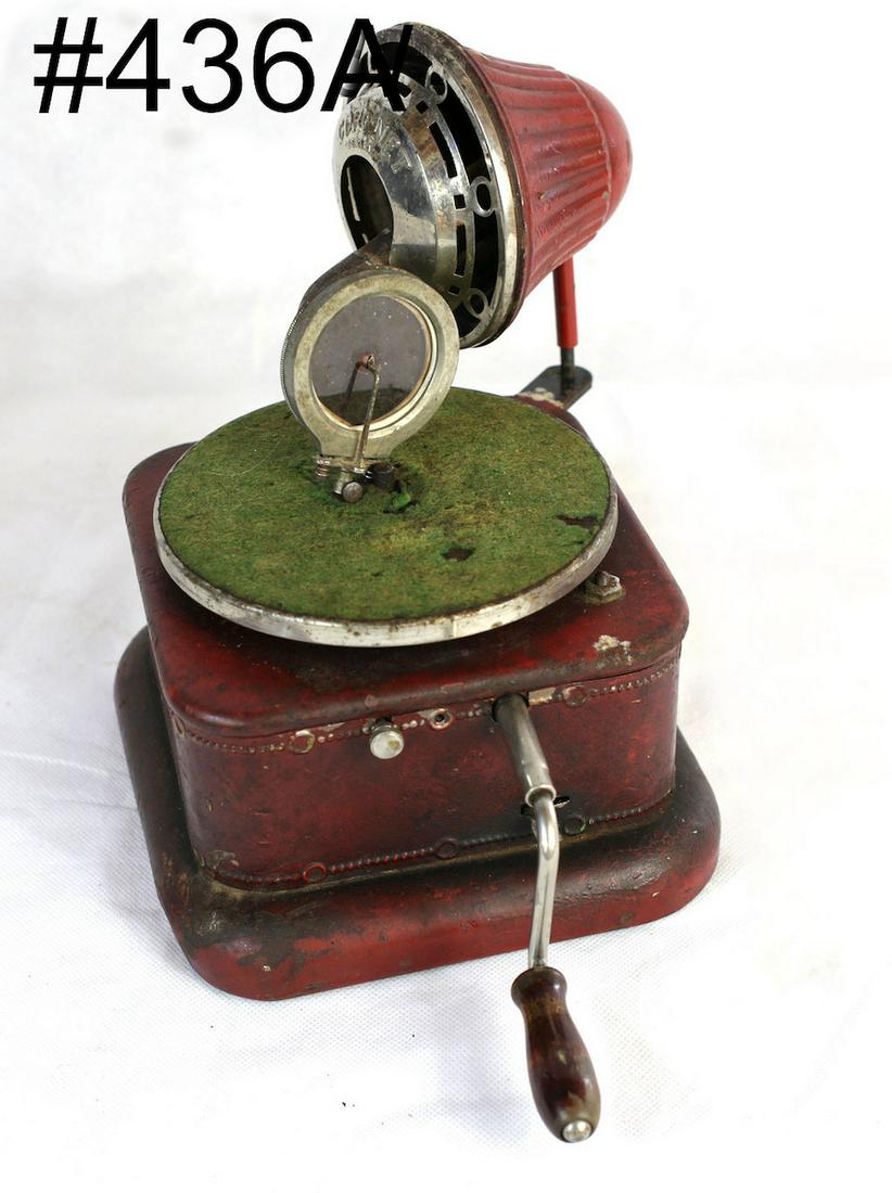 German Coronet child's disc phonograph: Complete with speaker horn, reproducer and crank. Red case