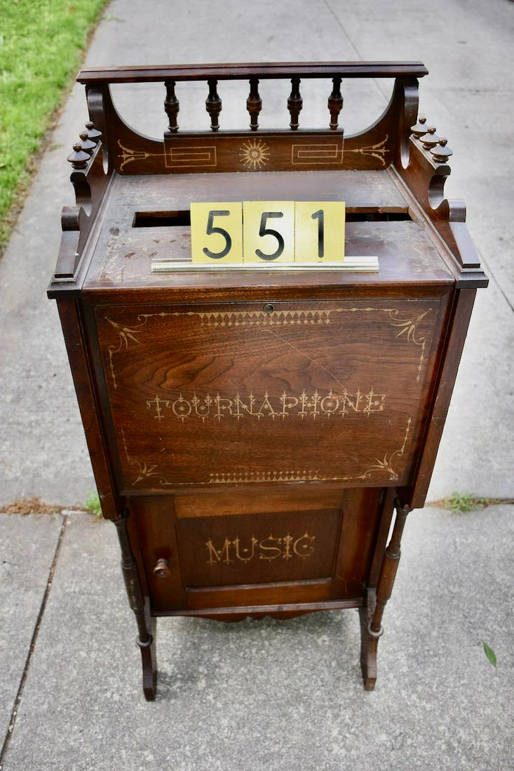 Rare Tournaphone floor model Paper roll organ: Storage for rolls in base cabinet. 2 rolls included. Walnut case with good stenciling. The rolls measure 14" long. A scarce machine as a floor model