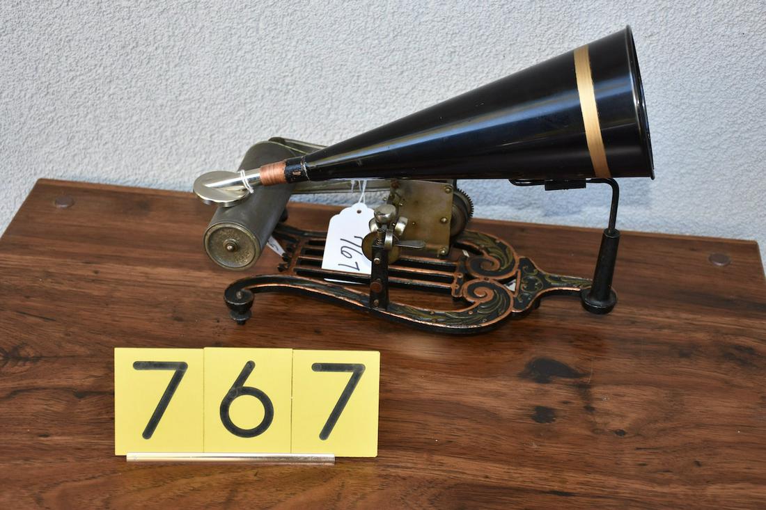 Puck Lyre base string driven phonograph: Has a conical horn, reproducer and winding key