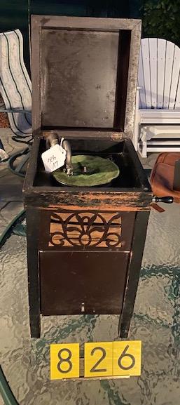 Child's upright disc phonograph. 1920's: Wooden case with reproducer and crank.