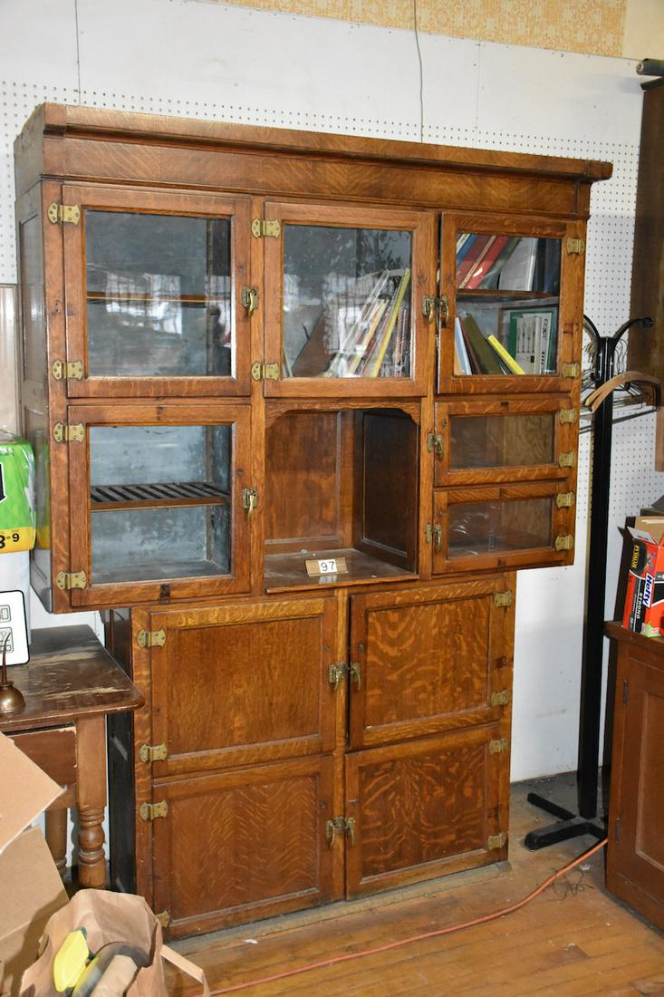 Section Oak Cabinet and Ice Box: 2 section oak unit with the top (pictured) section having 6 glass doors, 2 of the sections are lined for cooling. The bottom section has 4 larger sold oak doors and are also galvanized lined. The top 