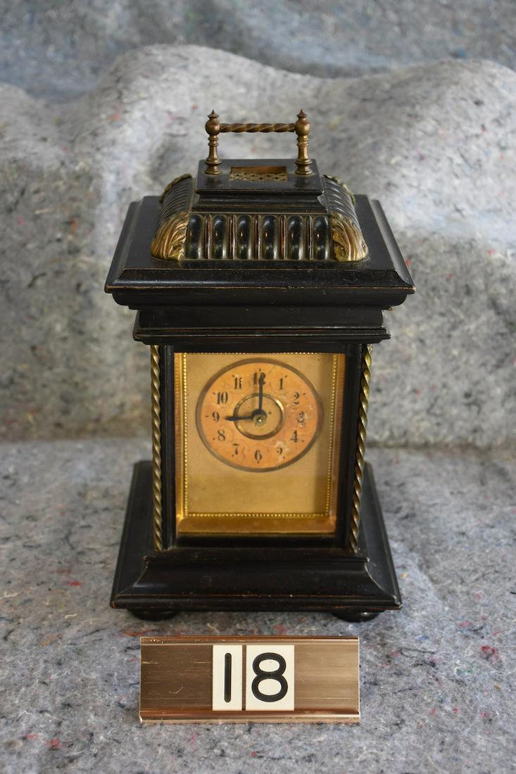 Symphonion Musical Clock: Disc movement music box that plays a 4-1/2" disc. No broken teeth. The disc is revealed by lifting the lid. Glass side and back. Winding key included. Not presently working. 13" tall x 7" square