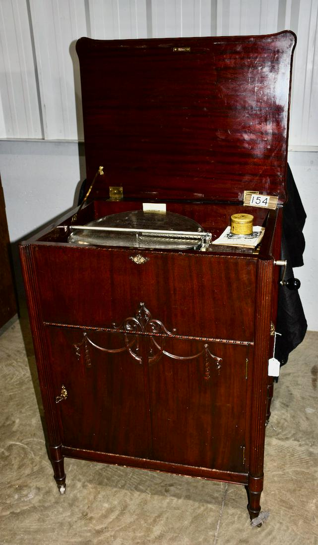 Stella Grand Console Disc Music Box: Plays a 17-1/4" disc. Mahogany cabinet. Very Good Condition with double comb and no broken teeth. Includes 7 discs. SN-4614