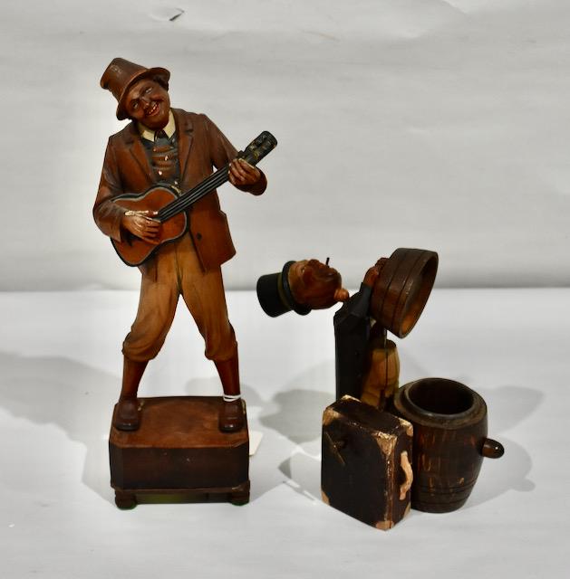 2 Carved Music Figures: Banjo player and the Drunk on the keg. Both play. 13" tall on the Banjo player