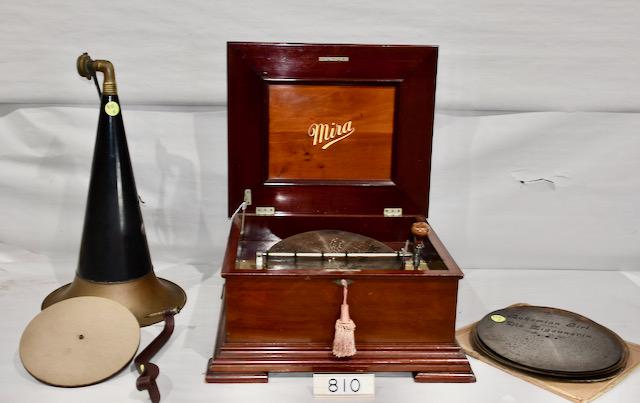Miraphone Table Model Disc Music Box/Phonograph: Plays a 12" disc. 12 discs included. Double comb with no broken teeth. Good mahogany cabinet. Has turntable, tonearm and reproducer. A complete unit with winding crank. Plays well