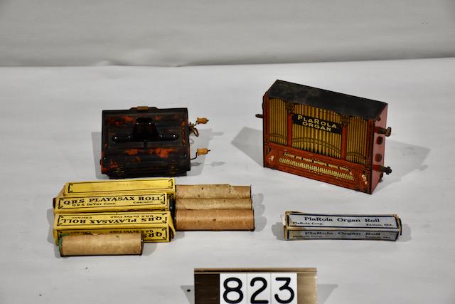 PlaRola Organ with Rolmonica: 1 roll for the PlaRola organ, 4 Rolmonica rolls, along with 3 QRS Playasax rolls in boxes