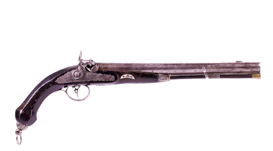 Cap lock Percussion Pistol: Unknown Maker; Wood frame; Highly decorated with silver overlay with figure; Firing pin; 18" OAL; Has ramrod;