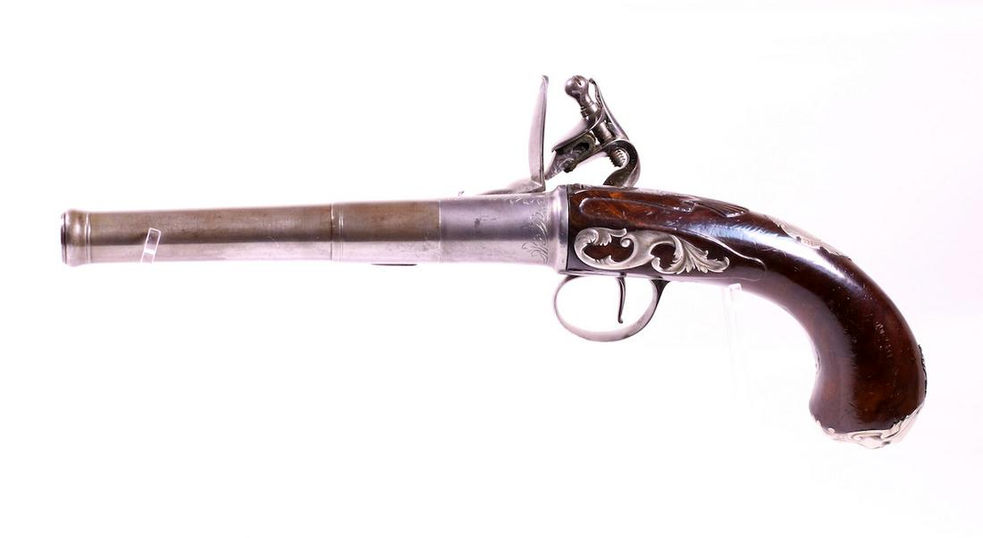 London Flintlock Percussion Pistol: John Harman; Screw off barrel; Proof marks; Walnut stock with ornate Grotesque Masque butt cap face; 12-3/4" OAL;
