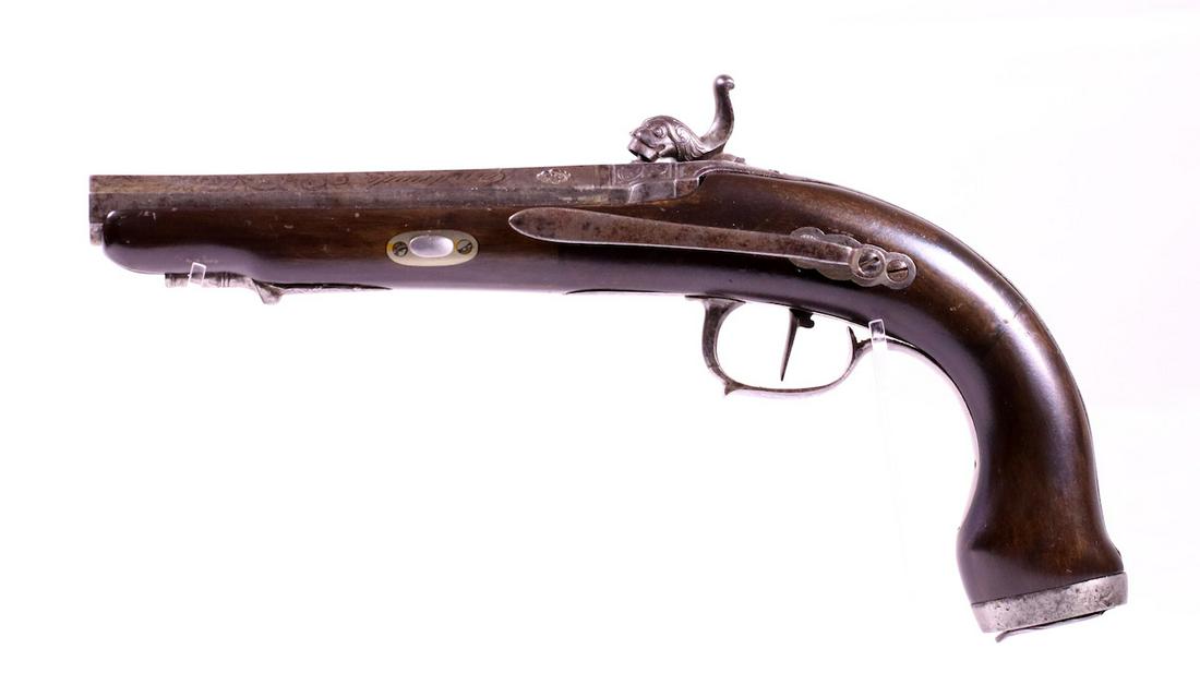 Spanish Cap lock Percussion Pistol: Marked Eybar with lion or Griffin's head; Walnut frame; Octagon barrel with engraving; Metal belt clip; Steel butt cap; Mfg. Manuel Urigoen; The lock is excellent; Repaired stock;