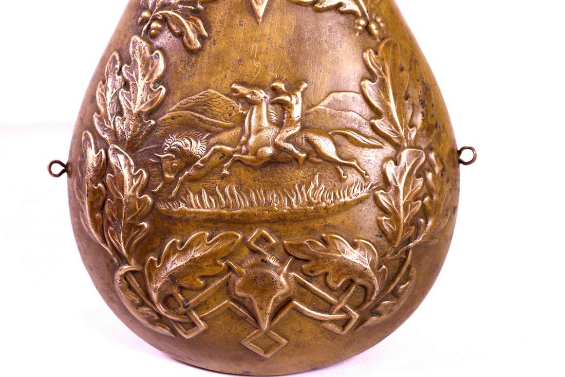 Powder Flash: Large decorative brass powder flash with elk head, acorn & rider on horseback. A.M. Flask Company. 19th century