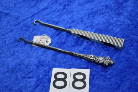 2 Button hooks: One has a sterling handle