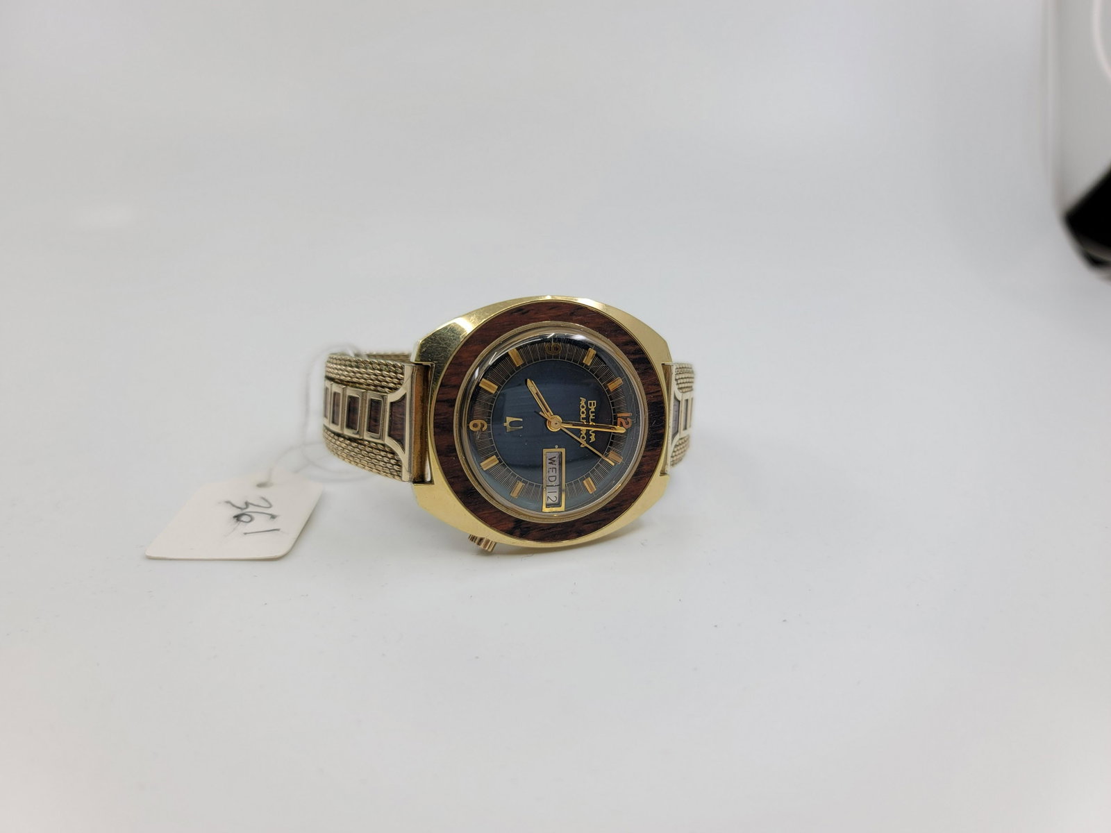 Bulova Accutron: Day - Date, 10kt gold filled, wood bezel, new battery and running, original matching gold filled band w/matchign wood accents